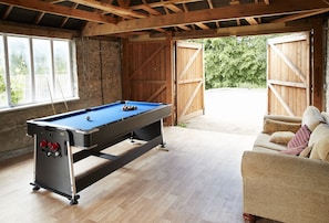 Games room with fridge, pool table, dart board (please bring your own darts), television and comfy chairs