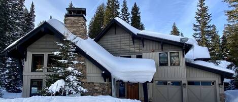 Exterior in winter - Parking for 2 cars in garages, and 2 in heated driveway!