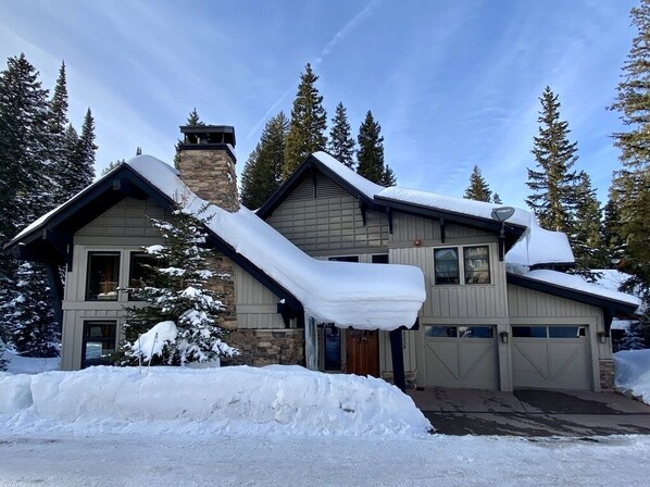 Exterior in winter - Parking for 2 cars in garages, and 2 in heated driveway!