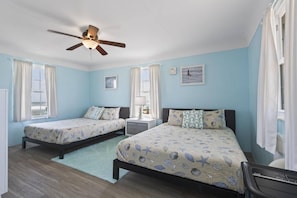 Queen sized beds await in the Quarter Deck vacation rental cottage located in Painter's Hill area of Flagler Beach.