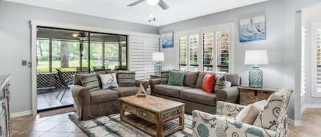 Living area opens to screened in porch