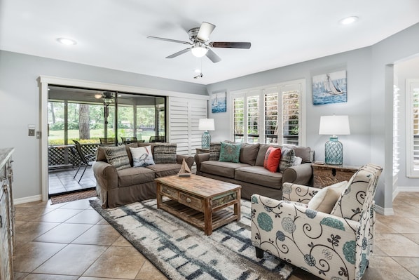 Living area opens to screened in porch