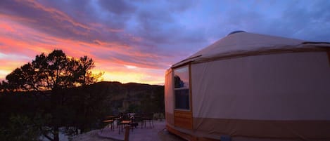 This yurt sits below the rim down in the trees.  But still has incredible views.  