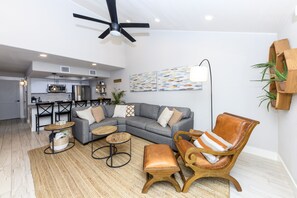 Livingroom has plenty of seating, oversized TV, and Queen sleeper sofa