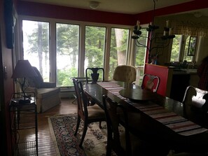 Dining room with sitting area and view of Crystal Lake with access to porch.