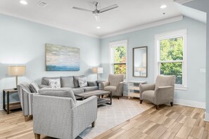 Enjoy the open-concept living and dining area with a stocked kitchen