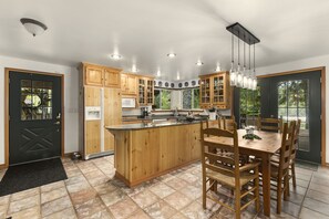 A fully-stocked wood-themed kitchen provides no shortage of rustic charm.