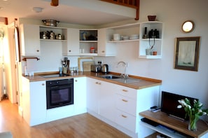 Open plan well equipped kitchen