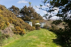 View from field to Neptune and Mini Neptune Shepherds Huts