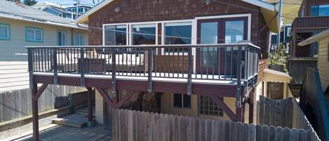 Front view of the home with large deck 
Room to park 2 vehicles off street