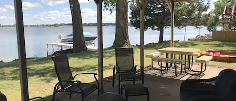 Covered Patio, Picnic Table and Sandbox. Tetherball and parking in back.