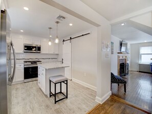 open floor plan with hardwood & tile throughout