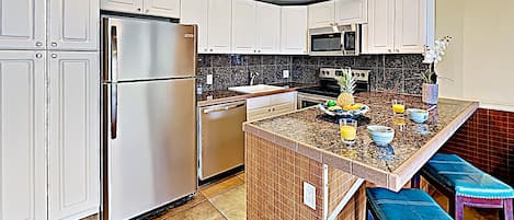 Kitchen - Beautifully remodeled kitchen with bar seating for two