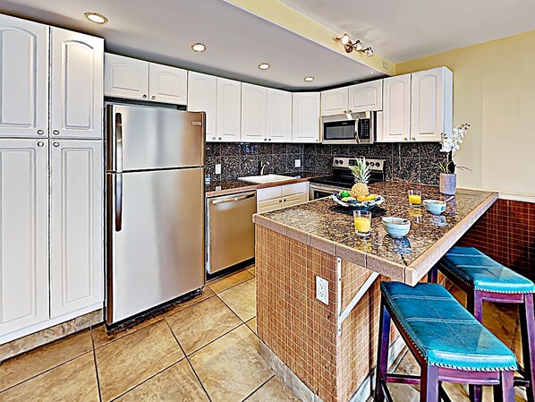 Kitchen - Beautifully remodeled kitchen with bar seating for two