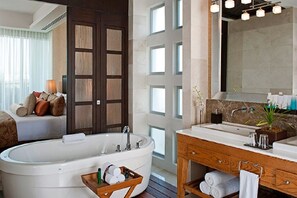 Bathroom with jacuzzi tub, two sinks and Shower.