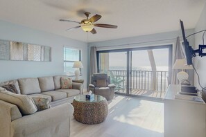 Direct Beachfront facing living room with plenty of seating, large flat screen TV