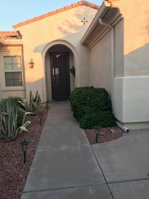 Entry way to home through private courtyard