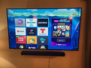 Sit back and relax in the living room with this 65 in flat screen Roku TV with streaming abilities