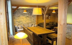 Share a meal with friends at the dining room table.