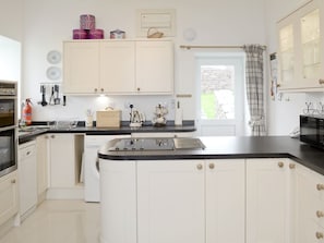 Well-equipped, modern fitted, farmhouse-style kitchen/dining room | The Old School House, Lonbain, by Applecross