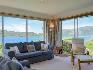Living room with large feature windows to take advantage of the stunning views | Dunyvaig, Colintraive, near Dunoon