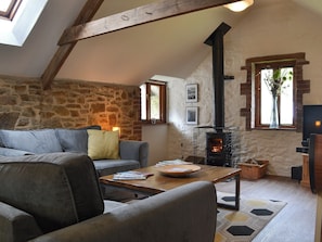 Living room with wood burner | The Old Coach House - Cranford and The Coach House Cottages, Cranford, near Clovelly