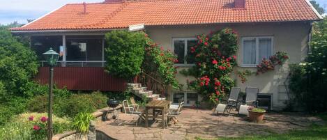 Sunny terrace and patio overlooking the garden