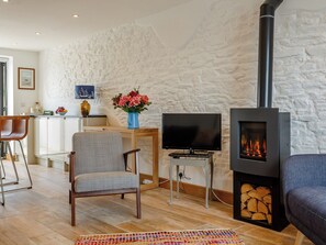 Warming wood burner within the living area | Wrens Perch, Brixham