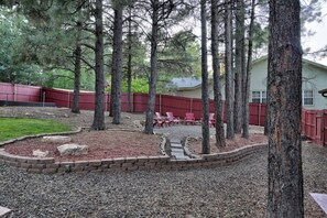 Large backyard with gas firepit and seating area