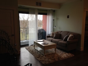 Living room with balcony overlooking the park.