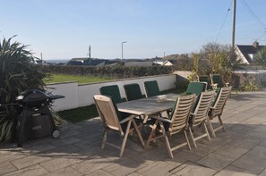 Garden terrace with view of the sea. Garden seating, BBQ & Hot Tub