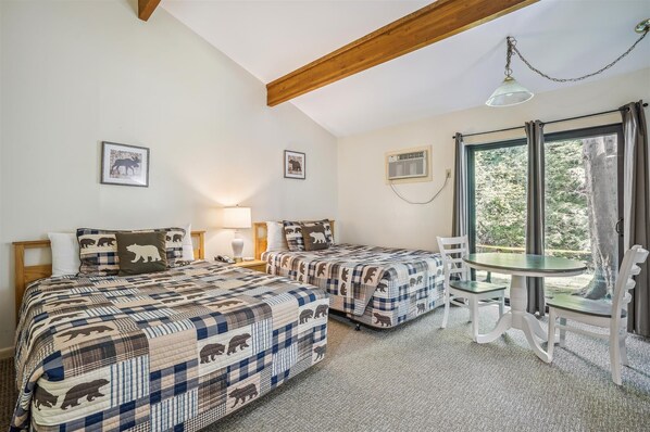 This bedroom offers 2 Queen beds.