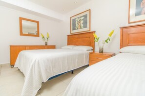 one bedroom with two double beds