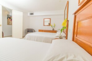 one bedroom with two double beds