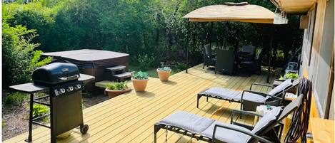 Amazing private deck with hot tub, BBQ grill, lounge chairs, and outdoor shower.