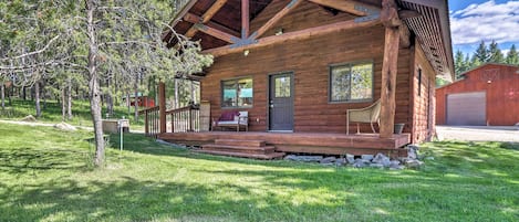 This 1-bedroom, 1-bath vacation rental cabin is nestled on a 40-acre ranch!