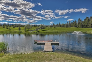 The property has a canoe, a lake, and stunning mountain views.