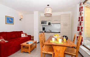 Relax in the gorgeous open-concept living space which adjoins with the fitted kitchenette.