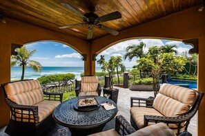 Enjoy sunset cocktails on the covered patio in super comfy chairs