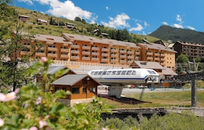 This residence is located opposite the Olympic ski slope and its chair lift.