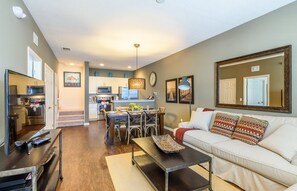 Comfortable living room integrated with kitchen.