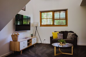 Lounge with 65 inch flat screen TV with access to Netflix