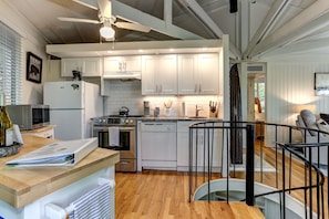 kitchen is equipped with dishwasher, full size oven, garbage disposal, microwave