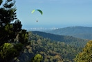 view of paragliders taking off from Rosins Lookout gliding past the cabin deck
