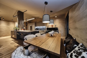 Kitchen and dining area at Ski Chalet Andorra Summit Penthouse in Soldeu