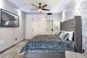 Master bedroom has ceiling fan and Smart TV