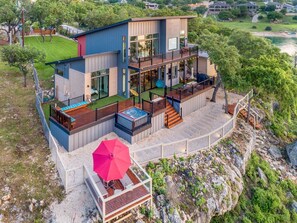 Aerial view rear from the left side of the home.