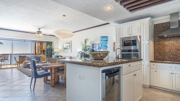 Spacious floor plan.THe kitchen island showing off its wine refrigerator.