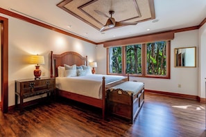 Garden view primary suite with king size bed