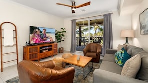 Living room is open and inviting and features a large flat screen TV